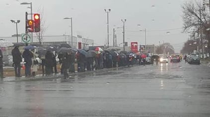 Eager consumers waiting in line to reserve the Tesla Model 3