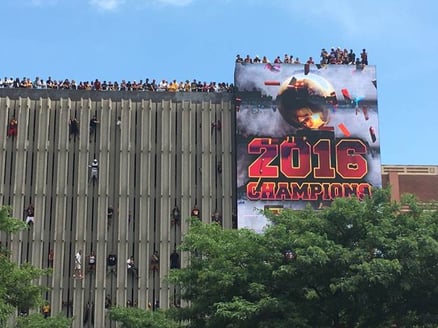 Cleveland fans scaling the building during championship parade